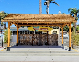 Example: African Reed Tiki Hut Gable Roof. Cedar Stain, Palapa Stands, Rope Kit,